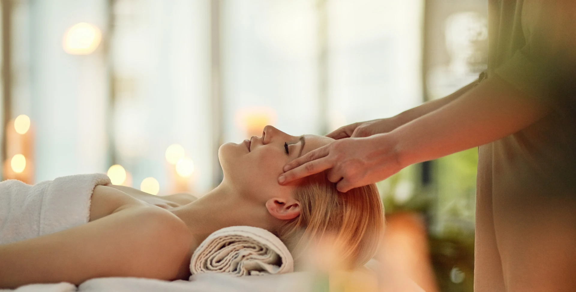 Woman receiving relaxing head massage